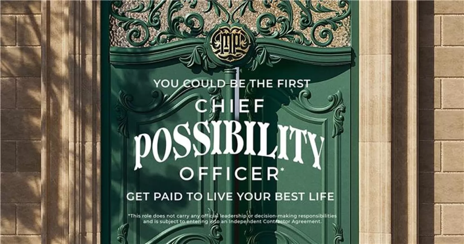 A decorative green door showcasing a recruitment ad for a "Chief Possibility Officer" role