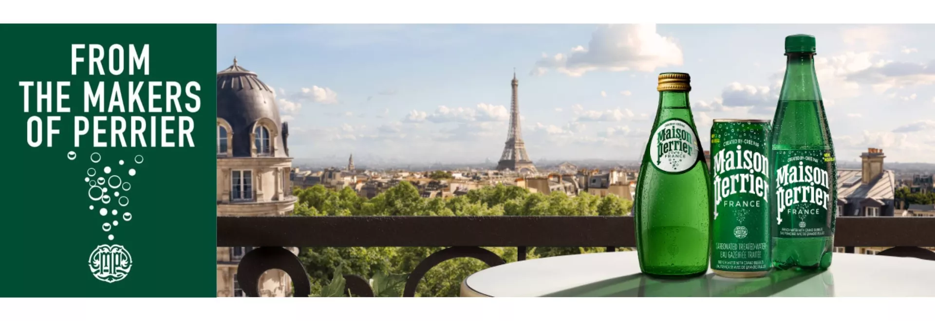 Unflavoured bottles on the table in front of the Paris view